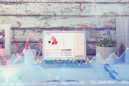 Composite image of a desk with computer, copybook, mug and folders