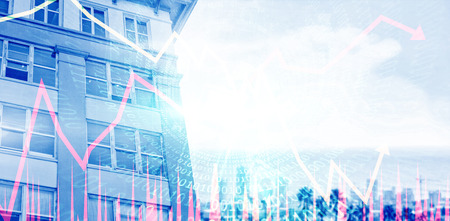 Low angle view of facade of office building against landscape of city and cloudy skyの写真素材