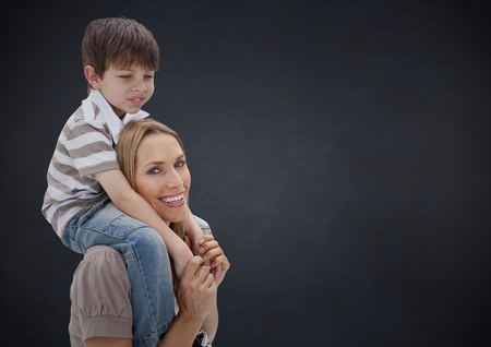 Digital composite of parent carrying her child against neutral backgroundの写真素材
