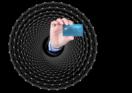 Digital composite of Hand Holding bank card against graphic dark background