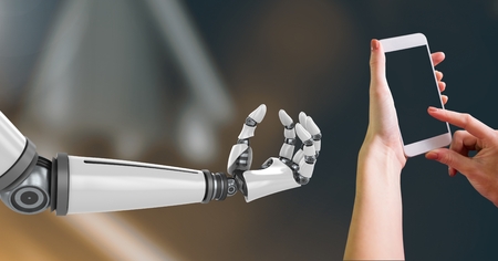 Digital Composite Image of Robotic and Human Hand with phone Interact against dark backgroundの写真素材