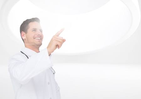 Smiling doctor using digital screen in hospitalの写真素材