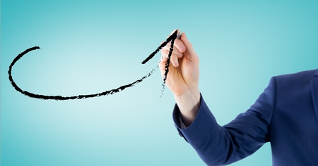 Digital composite image of business professional drawing a arrow against blue backgroundの写真素材