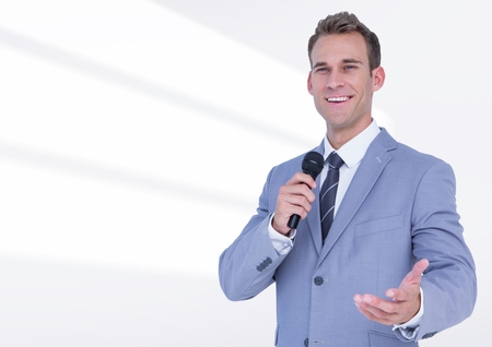 Composite image of businessman public speaking on microphone against white background