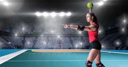 Digital composition of athlete playing handball against stadium in backgroundの写真素材