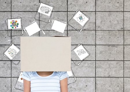 Digital composition of woman covered her face with a cardboard box with icons in backgroundの写真素材
