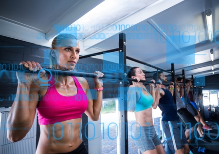 Digital composite image of fit people performing pull up exercise in gym