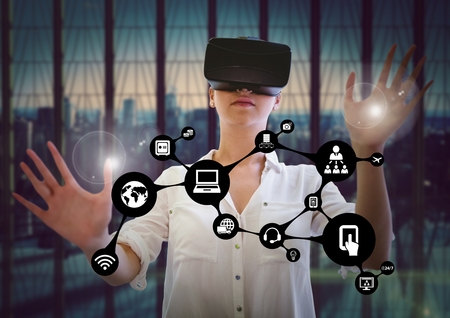 Woman touching interface flare while using virtual reality headset against digitally generated...