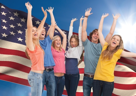 Digital composition of group of young people cheering against American flagの写真素材