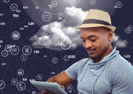 Digital composition of businessman using digital tablet against cloud computing concept in skyの写真素材