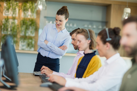 Team of customer service executives working in call center