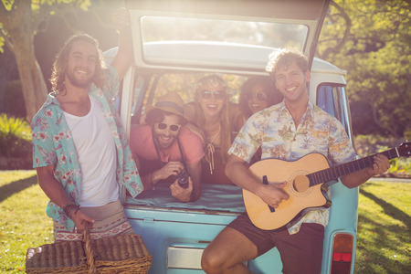 Smiling friends having fun at music festivalの写真素材