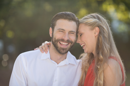 Romantic couple enjoying in park on a sunny dayの写真素材