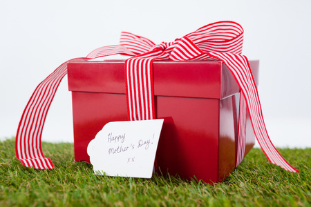 Happy mothers day card on gift box against white backgroundの写真素材