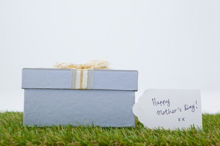 Happy mothers day card on gift box against white backgroundの写真素材