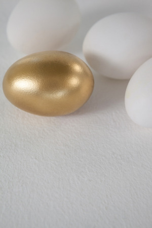 Close up of white and golden easter eggsの写真素材