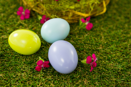 Close-up of multicolored Easter egg on green grass