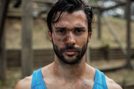 Portrait of determined man in boot camp training during dayの写真素材