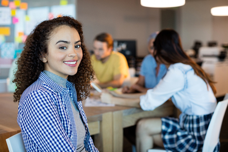 Portrait of smiling woman in officeの写真素材