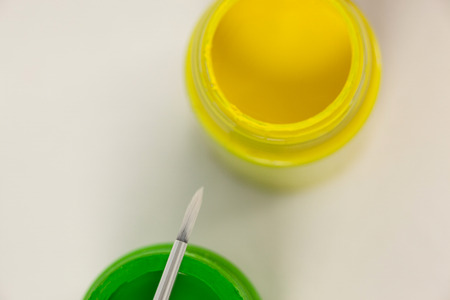 Close-up of watercolor paints and paint brush