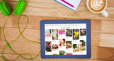 Composite image of website page against view of a business deskの写真素材