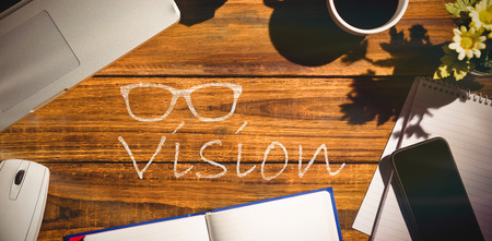 One pair of glasses against overhead view of an desk