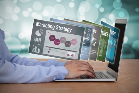 Cropped image of businesswoman using laptop against empty class room 3dの写真素材