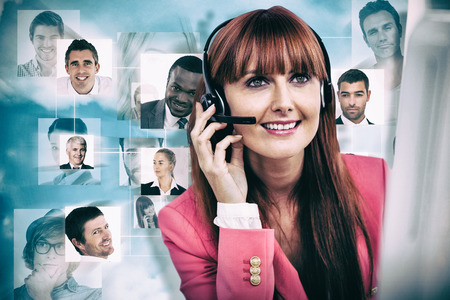 Smiling hipster businesswoman using headset against blue backgroundの写真素材