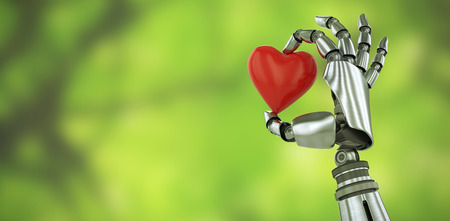 3d image of robot hand holding red heard shape decoration against trees in forestの写真素材