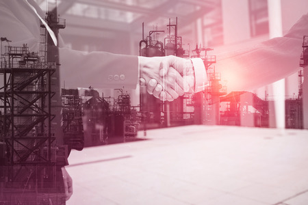 Businessmen handshaking in the streetの写真素材