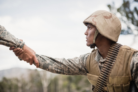 Military soldiers during training exercise at boot campの写真素材