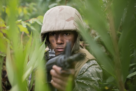 Military soldiers during training exercise with weapon at boot campの写真素材