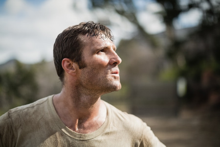 Military man standing during obstacle course in boot camp