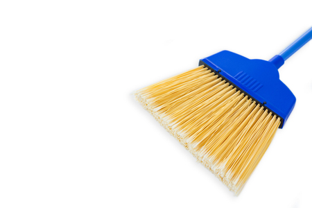 Close-up of blue broom against white background