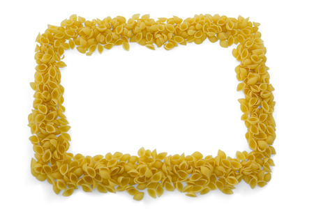 Overhead view of raw pasta arranged on white backgroundの写真素材