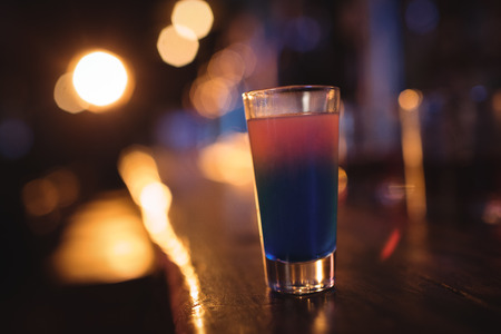 Close-up of cocktail drink at counter in pubの写真素材