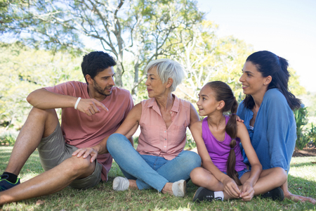 Happy family interacting in the park on a sunny day