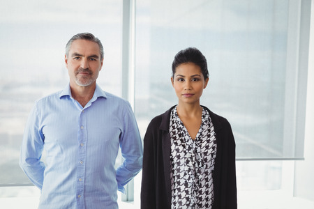 Portrait of executives standing together in officeの写真素材