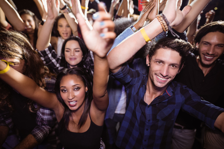Full frame shot of crowd at nightclub during music festivalの写真素材