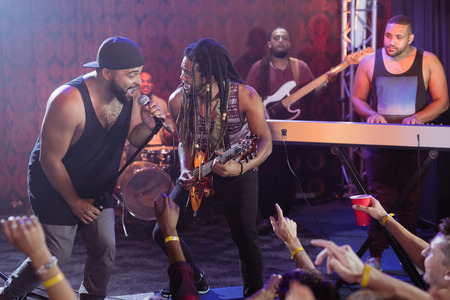 Performers singing on stage at nightclub