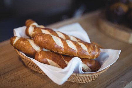 Close-up of sweet food kept in basket at counterの写真素材