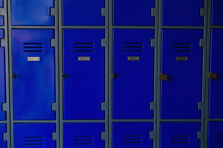 Close up of closed blue lockers at schoolの写真素材