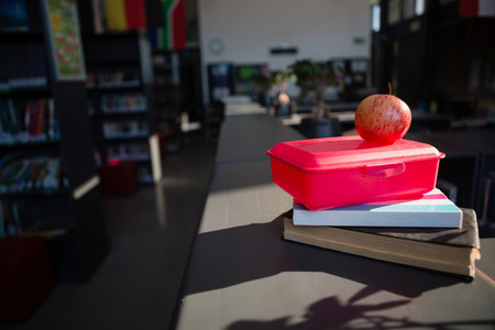 Close up of apple on tiffin box at library in schoolの写真素材