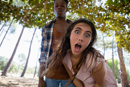 Young couple having fun together in the parkの写真素材