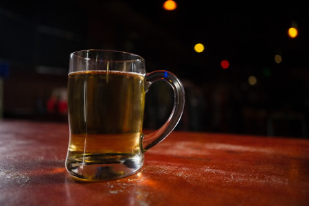 Close-up of beer mug on a tableの写真素材