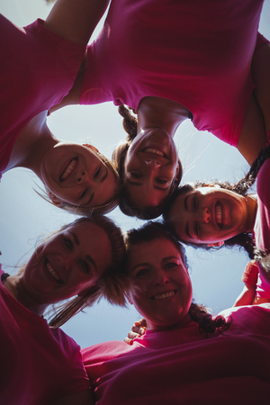 Portrait of womens group forming huddles in the boot campの写真素材