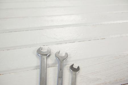 High angle view of wrenches on white tableの写真素材