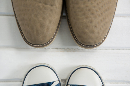 Cropped image of shoes on white floorの写真素材