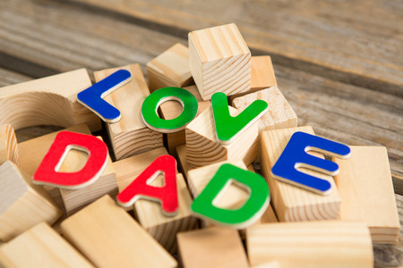 Close up of love dad text with wooden blocks on tableの写真素材