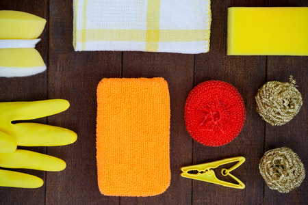 Set of cleaning equipment arranged on wooden floorの写真素材